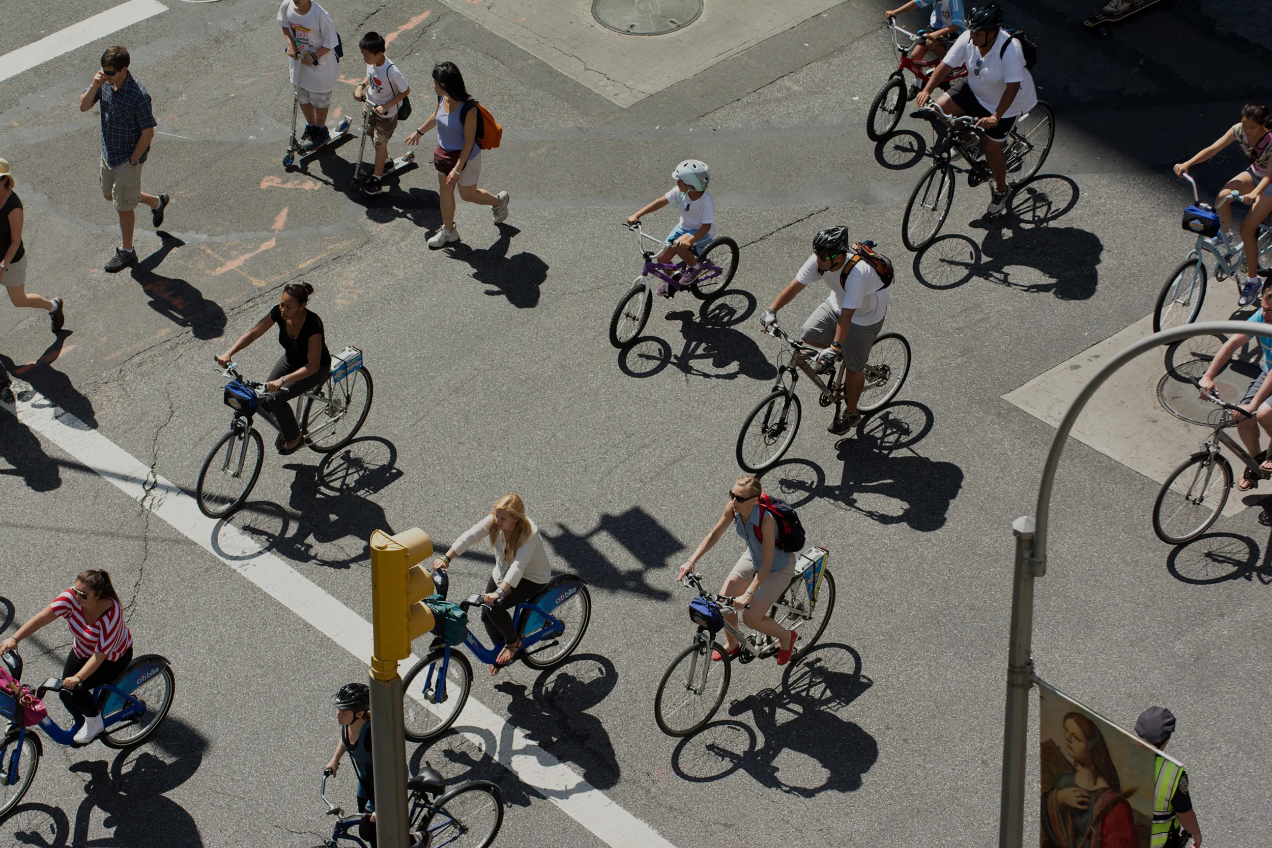 Aerial view of cyclists riding through a Boston intersection